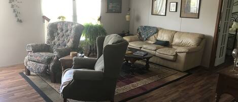 Flat-screen TV, DVD player, books, video library