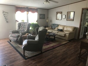 Flat-screen TV, DVD player, books, video library