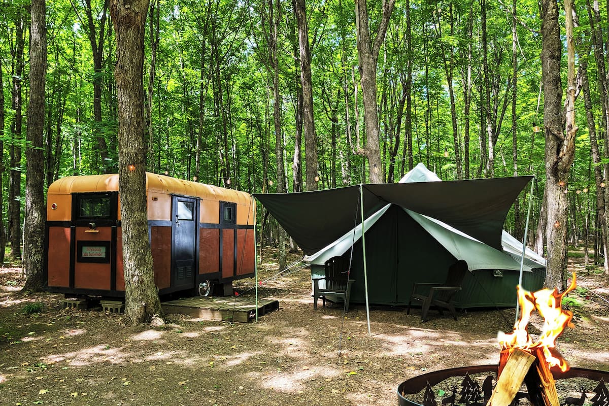 Jim Dandy Vintage Camper & Luxury Tent #8 (Premiere Resort Amenities Inc) | 2 bedrooms, Egyptian cotton sheets, premium bedding, memory-foam beds