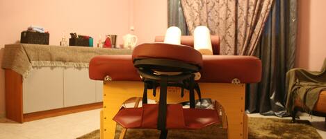 A room with a bed, a desk, and a chair.
