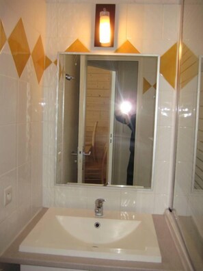 Bañera, secador de pelo