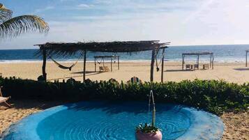 On the beach, free beach cabanas, sun-loungers, beach massages