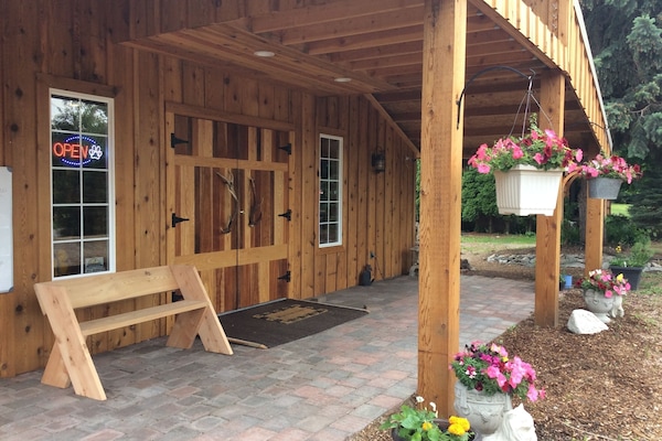 Shop for groceries and locally crafted gifts at Paws Produce, located on site.
