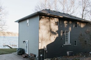A two-story house with a dock extending into a body of water. - Ideal Summer Getaway! Two-story lake home on Rush Lake near Rush City/Cambridge (Stanchfield)