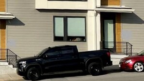 A modern multi-story building with a flat roof, large windows, and a mix of wood and siding materials. - Amazing Location with Private Rooftop (Nashville)