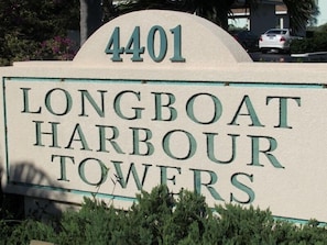 A sign for Longboat Harbour Towers with the number 4401.