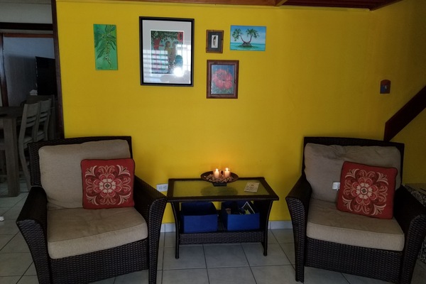 Lovely sitting room with double doors that open to the porch