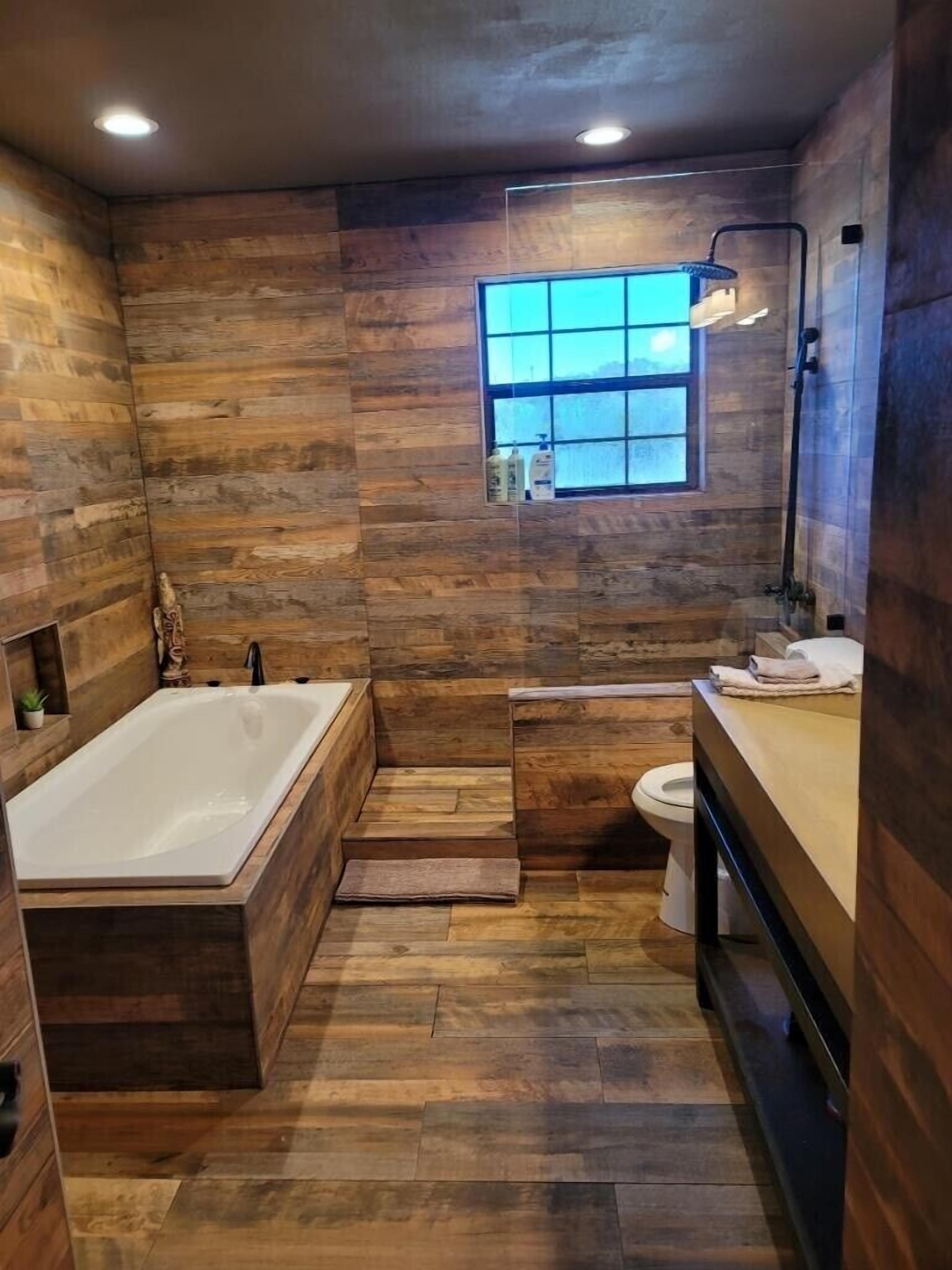 Bathtub, hair dryer, towels, soap