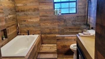 Bathtub, hair dryer, towels, soap