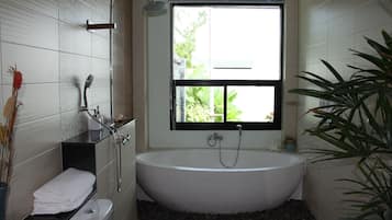 Bathtub, hair dryer, towels, soap