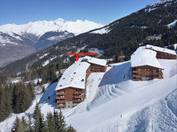 Experience the serene beauty of the mountains from this traditional chalet-style lodge, surrounded by dense forests and towering peaks.
