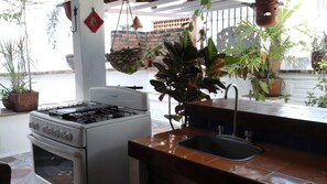 Fridge, oven, coffee/tea maker, cookware/dishes/utensils