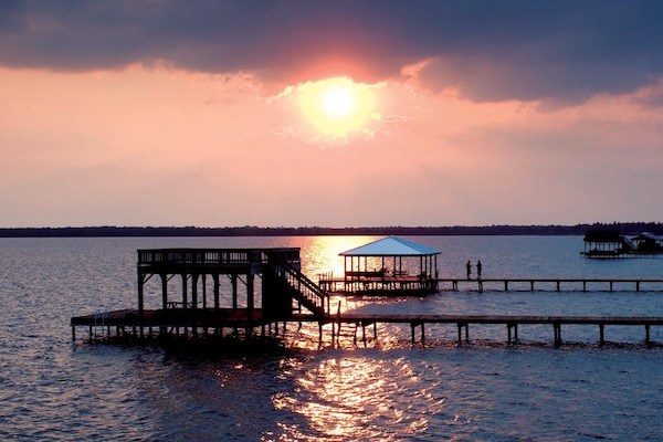 Picture yourself on the boat house with the blue roof.
