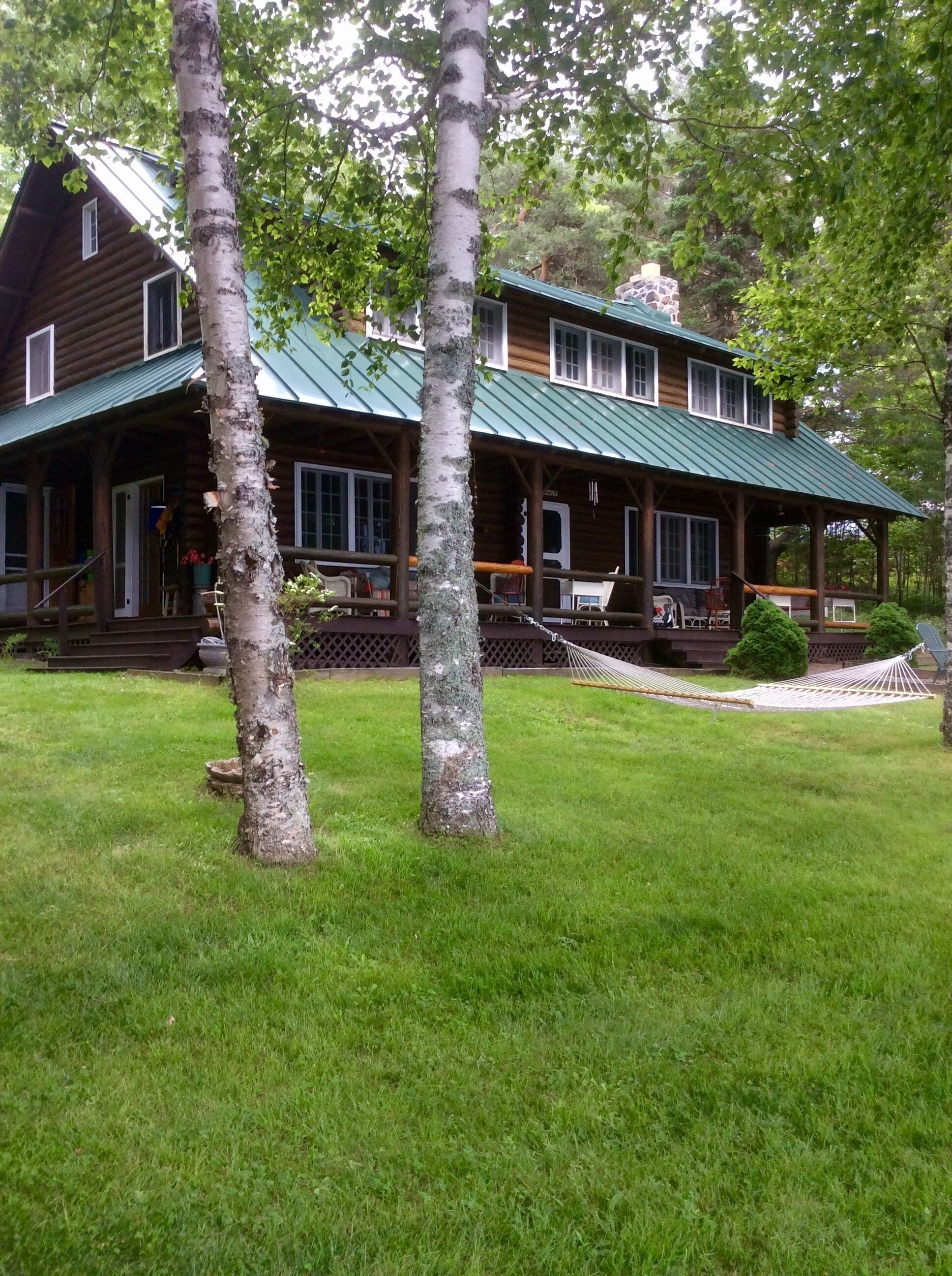 Justawhim-Private Lakefront Log Lodge with Old World Charm steps from the water.