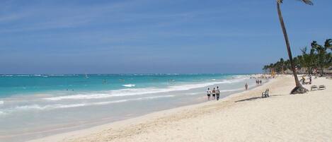 On the beach, sun-loungers, beach umbrellas, beach towels