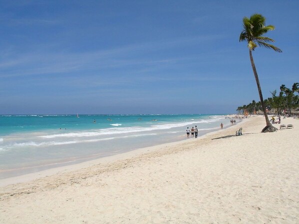 On the beach, sun loungers, beach umbrellas, beach towels