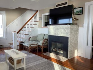 Smart TV, fireplace, books