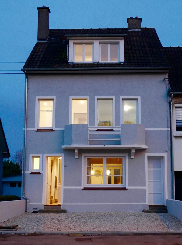 A two-story residential building with a balcony, multiple windows, and a visible entrance. - House For Rent Le Touquet / Cucq (Cucq)