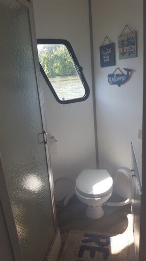 Shower, towels, soap, toilet paper