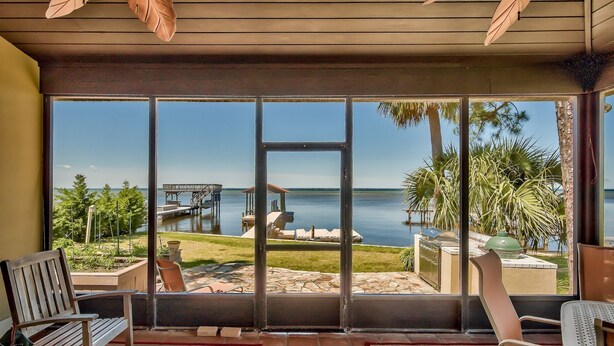A room with a large sliding glass door leading to a balcony with a view of the ocean and a dock. - Destin Festival!!  Sept 24 - 28  Available (Miramar Beach)