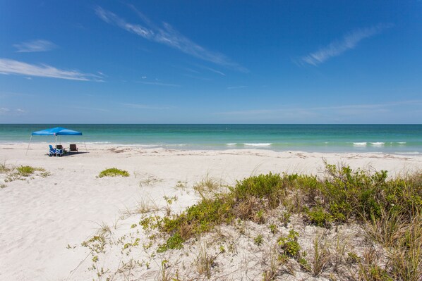 On the beach, sun loungers, beach towels