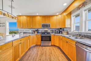 Fridge, microwave, oven, stovetop - Oceanfront Avon Home with Private Pool, Hot Tub, Deluxe Game Room, Tiki Bar (Avon)