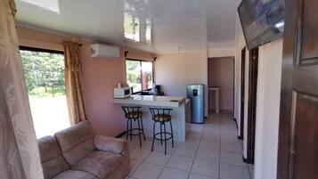 Family Villa, 2 Bedrooms, Garden View | Living area | 32-inch Smart TV with cable channels, TV, Netflix