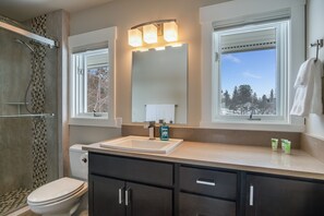 Shower, hair dryer, towels, toilet paper