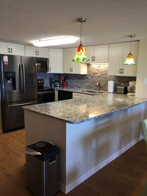 Fridge, microwave, oven, stovetop - Serene Oceanfront Getaway Cherry Grove (North Myrtle Beach)3BR (North Myrtle Beach)