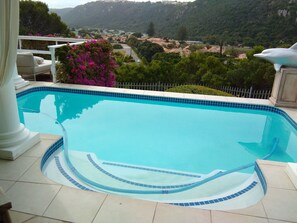2 outdoor pools, open 10:00 AM to 6:00 PM, pool umbrellas, pool loungers