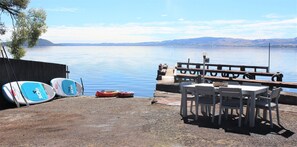 Outdoor dining - Lakeside apartment with boat ramp & jetties (Koutu)