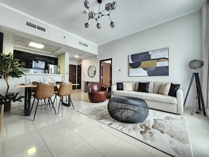 Deluxe Apartment, 1 Bedroom, Marina View | Living area | 14-inch flat-screen TV with satellite channels, TV