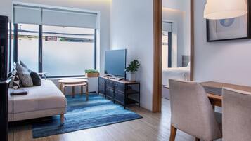 Deluxe Apartment, 1 Bedroom, Kitchen | Living area | 43-inch flat-screen TV with cable channels, LED TV