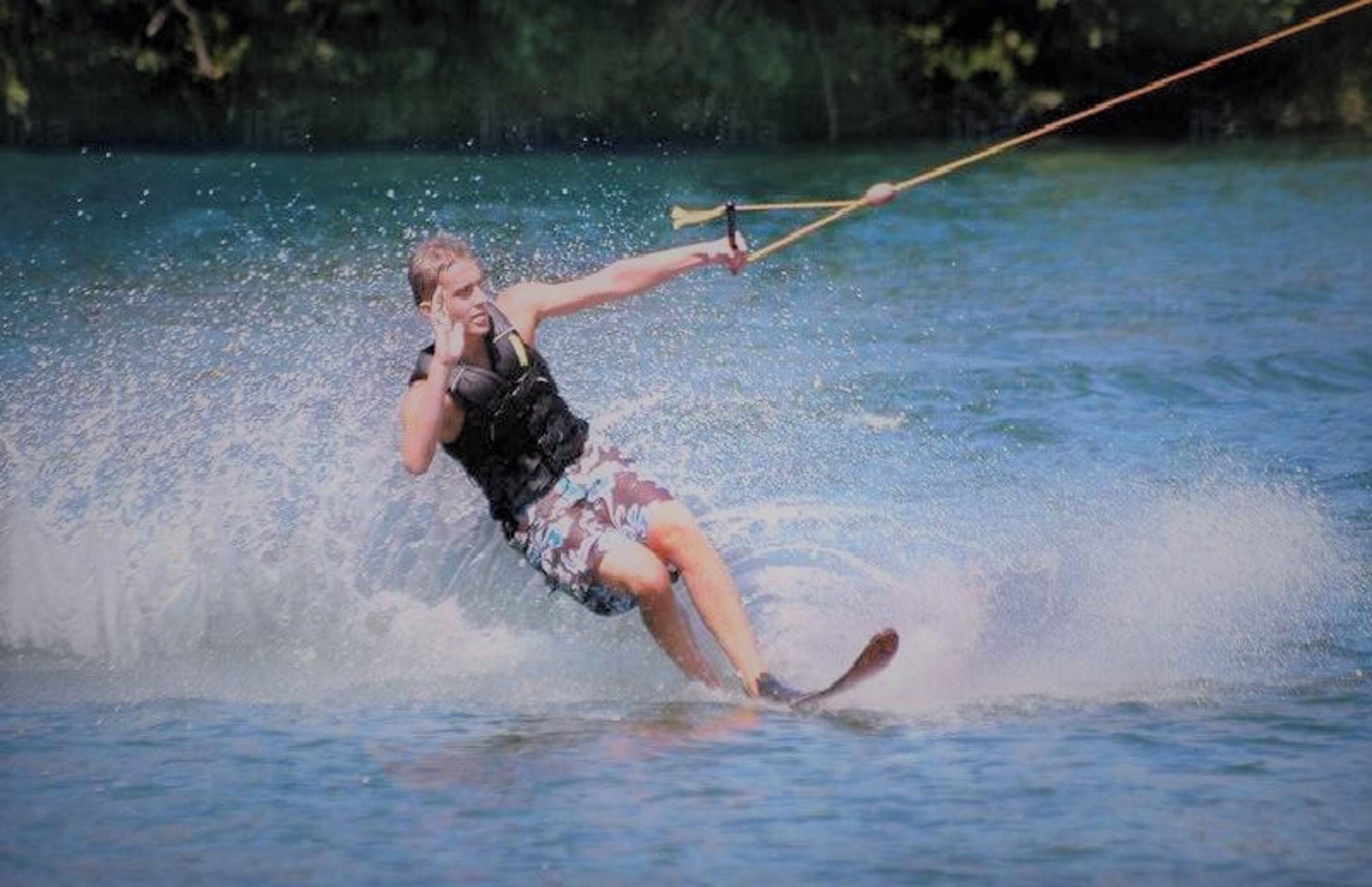 A person water skiing on a lake.
