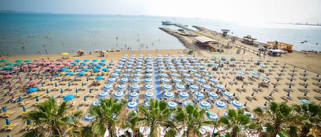 Private beach, beach umbrellas