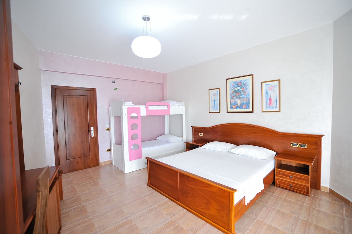 Family Room, Multiple Beds, Non Smoking, Sea View | Minibar, in-room safe, desk, laptop workspace