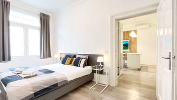 Deluxe Apartment, City View | Living area | 55-inch flat-screen TV with digital channels, TV