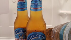 Two bottles of Kalik beer in a refrigerator. - Kozy Bahamas Getaway (Nassau)