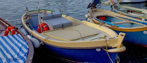 A marina with various small boats docked.
