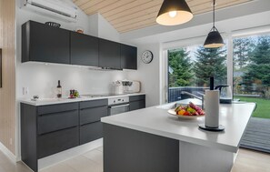 Fridge, stovetop, dishwasher, coffee/tea maker