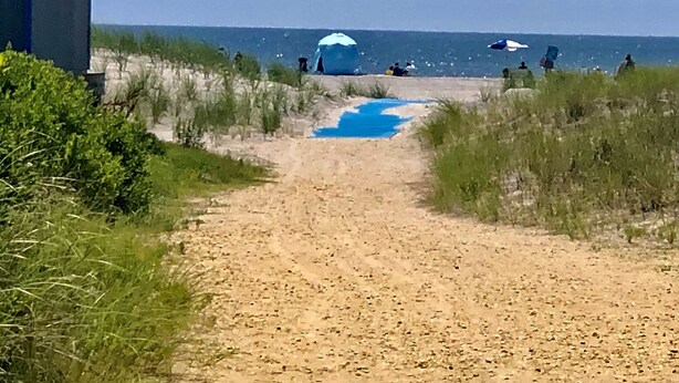 A sandy path leading to a beach with tents and umbrellas. - BRIGANTINE TOP LOCATION! WALK TO BEACH, EATERIES. 12 NOON CHECKOUT. DOGS OK (Brigantine)