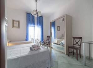 A bedroom with a bed, a chair, a desk, and a mirror. - Rustic villa with private pool (brindisi)