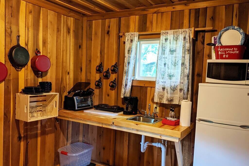 Fridge, microwave, coffee/tea maker, cookware/dishes/utensils