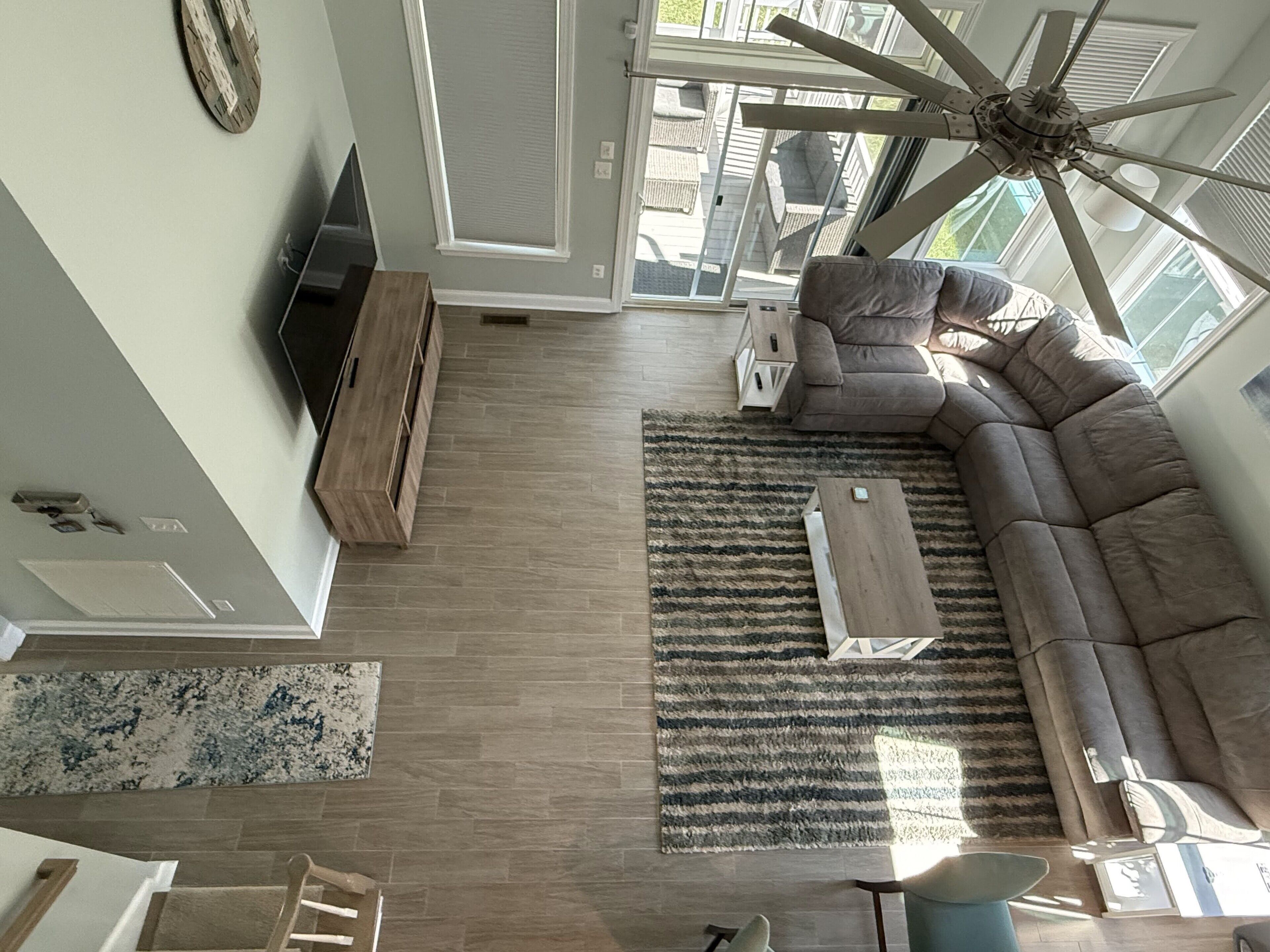 Living room with reclining couch and big TV