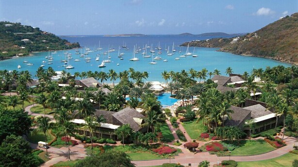 A resort with multiple buildings, a swimming pool, and numerous sailboats on a turquoise sea. - AMAZING Westin St John!!  3 BD/3 BA Villa (Great Cruz Bay)