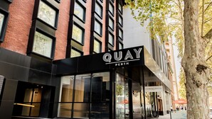 A modern building with a sign reading "QUAY PERTH" and a storefront with large windows. - Quay Perth (Perth)