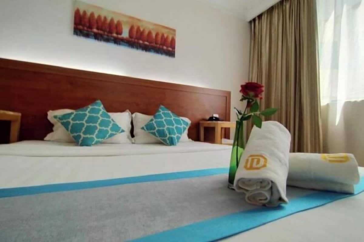 Desk, blackout drapes, iron/ironing board, bed sheets