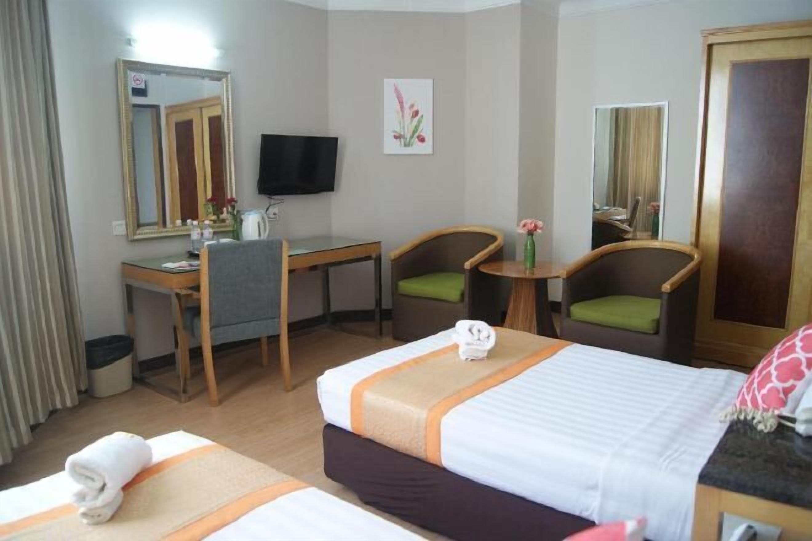 Desk, blackout curtains, iron/ironing board, bed sheets