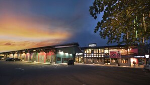 A hotel with a lobby and multiple colorful buildings. - The Wood Boutique Hotel (Muar)