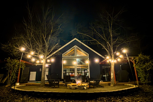Firepit and string lights under starry skies!